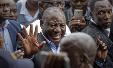 President Cyril Ramaphosa greets supporters after casting his vote in Soweto, Johannesburg.