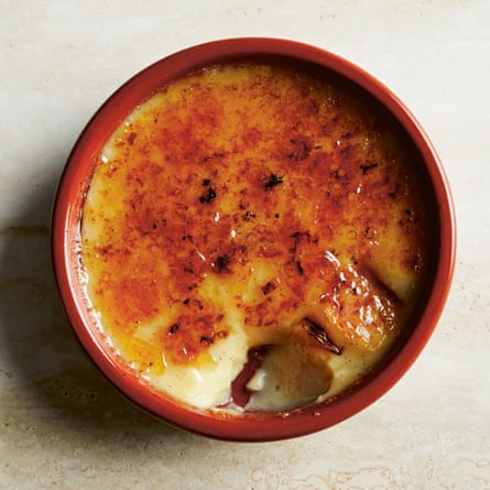 Topview of a creme brulee in a ramekin, with a scoop taken out of it.