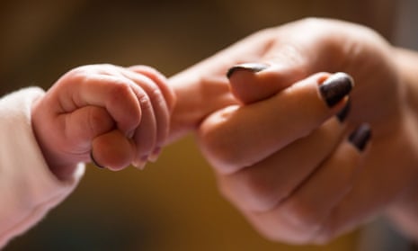 Child holding mother's hand