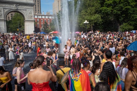People gather in Washington Square Park after the Pride parade in Manhattan, 2023.