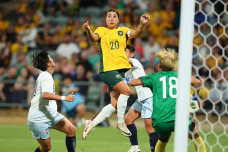 Sam Kerr leaps for a header in front of goal.
