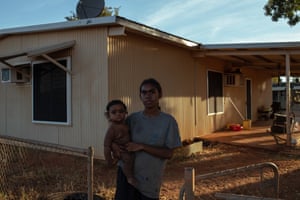 Chantelle Shovellor, 18, holding her son Tyzayis, who is 10 months old at the front of her house at Pandanus Park. Pandanus Park is a medium-sized Aboriginal community, located 60km south of Derby in the Kimberley region of Western Australia.