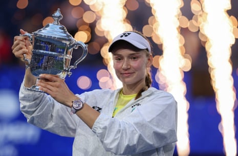 Elena Rybakina holds her trophy.