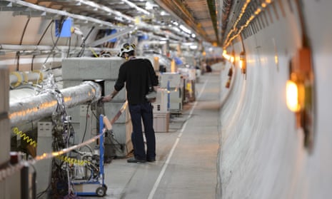 A technician works on the Large Hadron Collider, near Geneva, Switzerland.