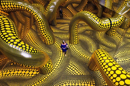 Visitors walking through the artwork Infinity Mirrored Room during a preview of a Yayoi Kusama exhibition at the Museum Ludwig in Cologne, March 2026.