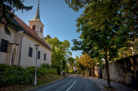 Tree-lined street and church in leafy street