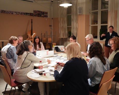 Staff members count ballots at a counting station in Stockholm, Sweden.