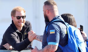 Prince Harry, Duke of Sussex talks to members of Invictus Team Ukraine at the Athletics Competition during day two of the Invictus Games The Hague 2020 at Zuiderpark on April 17, 2022 in The Hague, Netherlands.