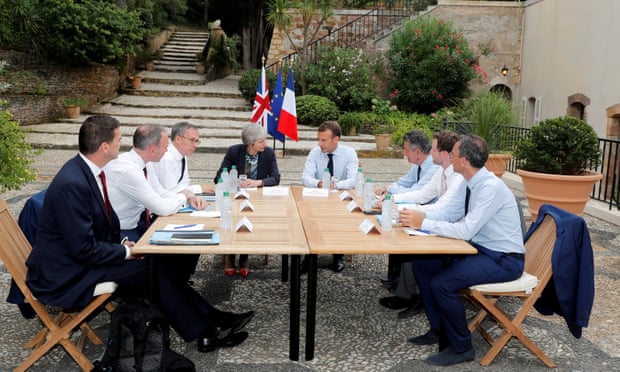 Theresa May and Emmanuel Macron meet at Fort de Brégançon last week with their ambassadors and officials. 