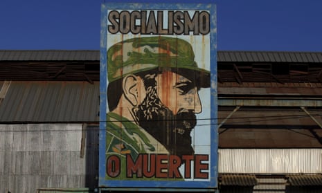 “Socialism or death”, a billboard reads with Fidel Castro’s face on it.