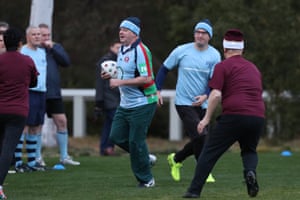 Anthony Albanese takes the ball at the annual NSW-QLD political State of Origin football game on the Senate oval of Parliament House in June 2018.