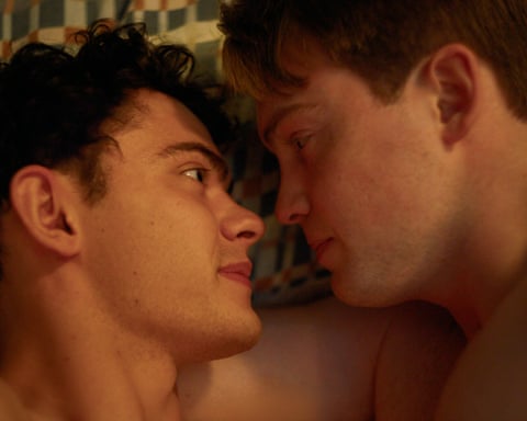 two young men in bed