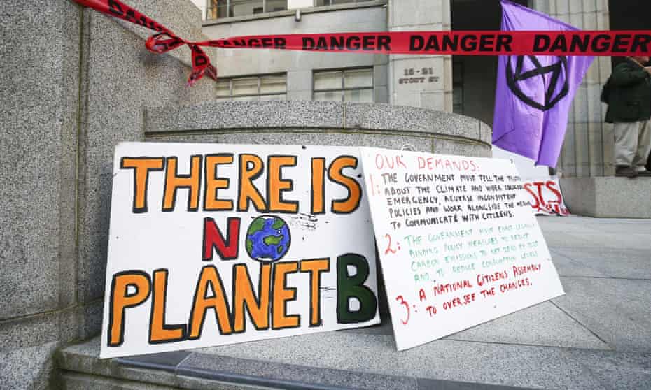 Signs on display during an Extinction Rebellion protest in October 2020