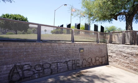 Graffiti sprayed at Wesley Bolin Plaza can be seen after multiple nights of abortion-rights protests at the Arizona capitol in Phoenix in June.