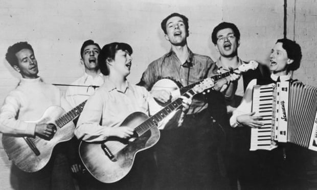 Seeger, centre with banjo, and the Almanac Singers, including Woody Guthrie, far left, in 1940.