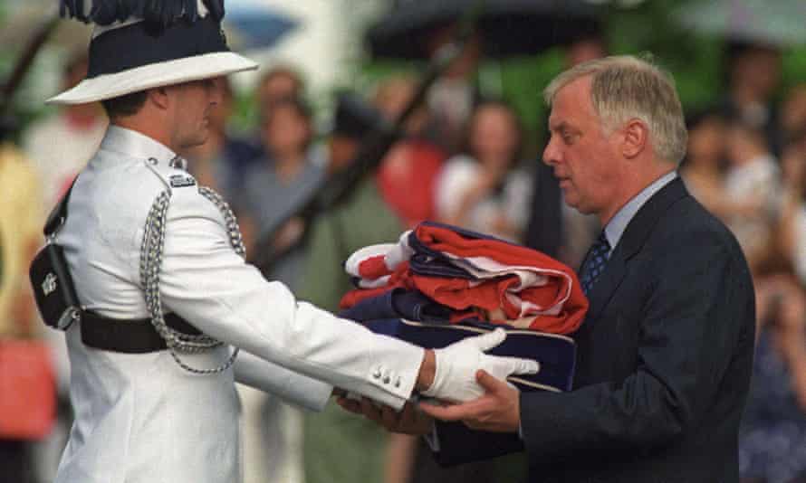 Patten receiving the union flag after it was lowered for the last time at Government House - the governor’s official residence - during a farewell ceremony in Hong Kong in 1997.