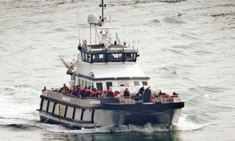 A group of people are brought in to Dover, Kent, onboard a Border Force vessel.