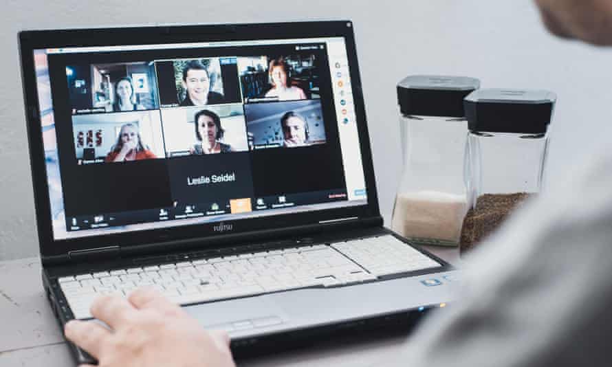 Young man prepares meeting with Zoom software
