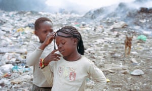 Two girls at the the rubbish dump in Eldoret known as California Barracks, where the police raid occurred.
