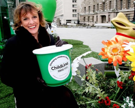 Esther with a green Childline donations bucket