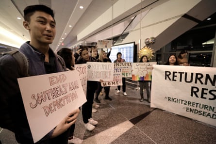 A man holding a sign