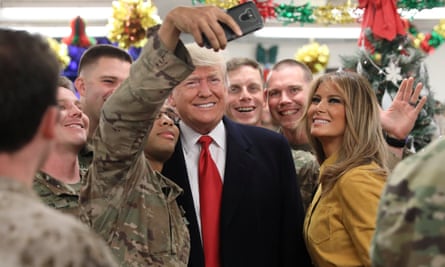Donald and Melania Trump greet military personnel at Al Asad airbase in Iraq on 26 December.