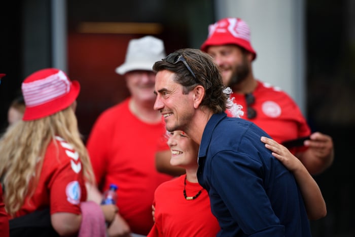 Thomas Frank stops for pictures with Danish fans outside the stadium.