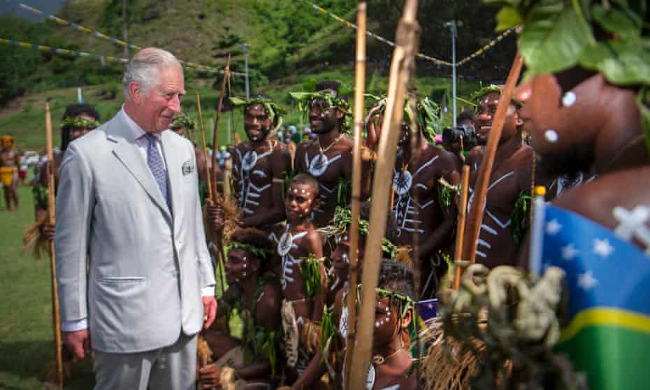 Prince Charles meets traditional dancers from the island of Guadalcanal at a community event focused on oceans at the Lawson Tama Stadium in Honiara.