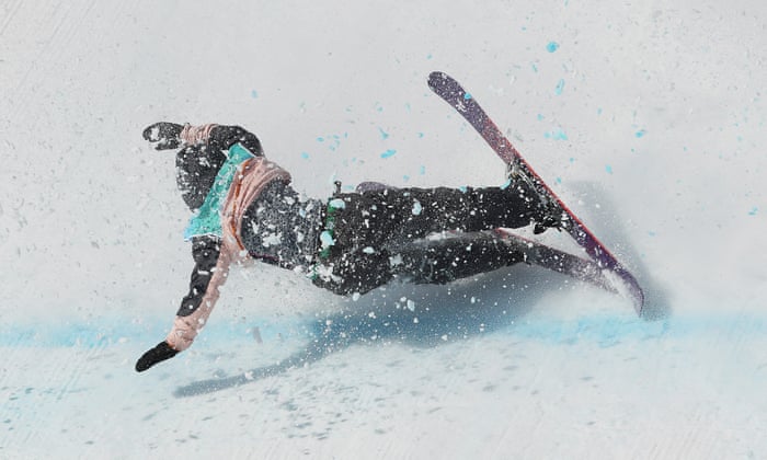 Sandra Eie kicks up clumps of snow as she crashes.