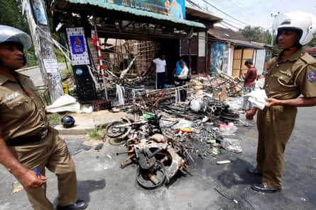 Police attend the aftermath of anti-Muslim rioting in Digana, near Kandy, Sri Lanka, March 2018.