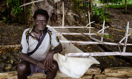 Peter Das beside a canoe in PNG's New Ireland province