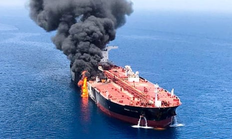 An oil tanker burns after the attack on 13 June in waters between Gulf Arab states and Iran.