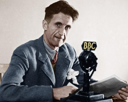 George Orwell, real name Eric Blair, pictured in London in 1943. He sits next to a BBC mic.