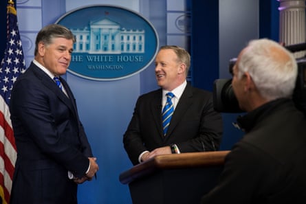 Sean Hannity speaks with then press secretary Sean Spicer at the White House on 24 January 2017.