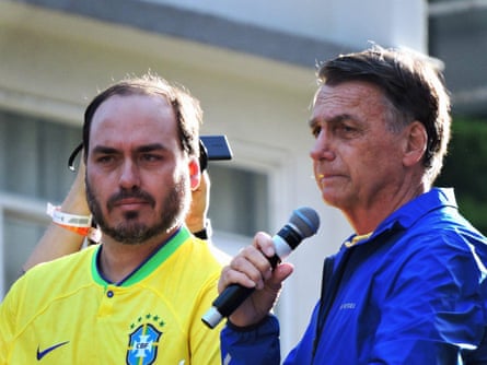 Eduardo Bolsonaro with his father in Sao Paulo in June 2025.