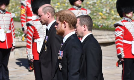 The Duke of Cambridge, Peter Phillips and the Duke of Sussex walk behind the Land Rover hearse.