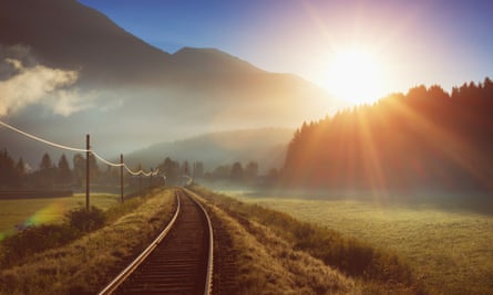 Sunrise over a railway line in the Alps in Austria.
