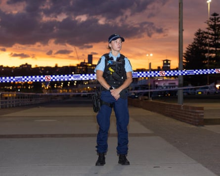 A police woman guards the scene at Bondi.