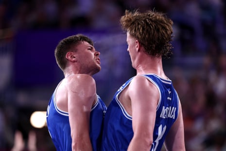 Fraser Malcolm and Owen McCormack celebrate Scotland’s victory over Malaysia with a chest bump.