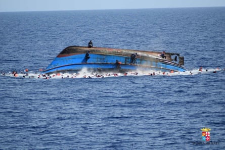 A boat overturns off the coast of Libya