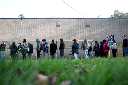 A queue of young people outside a sports centre
