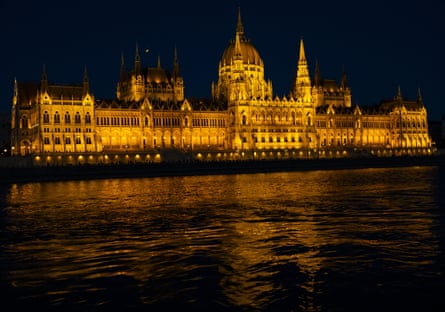 A night view of the historic landmarks along the Danube River in Budapest, Hungary