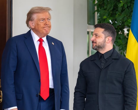 President Volodymyr Zelenskyy looks up at President Donald Trump outside of the West Wing before the two walk in for their meeting at the White House last month.
