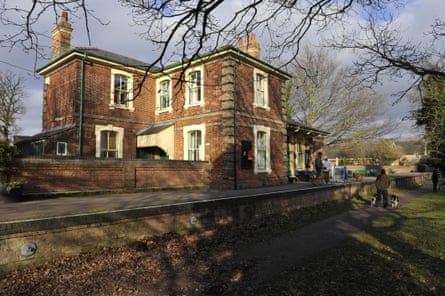 An imposing former railway building made of brown brick.