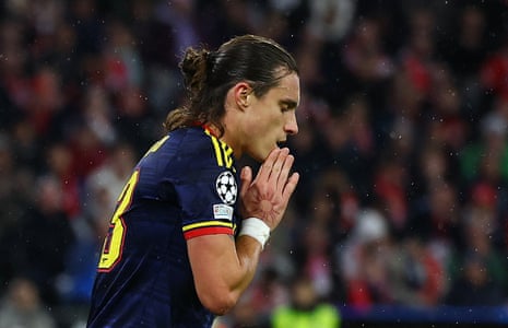 Arsenal's Riccardo Calafiori holds clasped hands to his face, reacting after a miss.