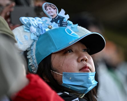 A spectator shows her devotion to Mercedes’ George Russell with distinctive headgear celebrating the British driver