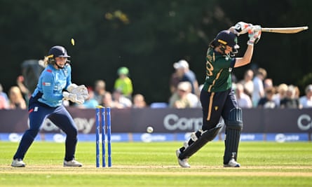 England wicketkeeper Bess Heath celebrates as Jane Maguire is bowled by Kate Cross.