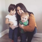 Maria Bataller, kneeling with her small daughter and son making silly faces