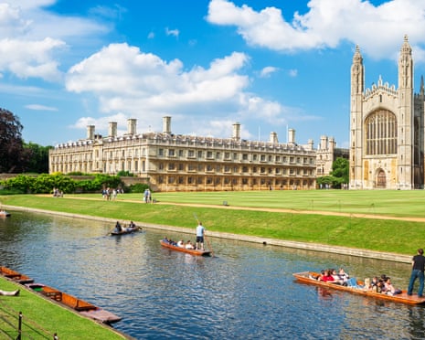 Tourists on a punt trip near Kings College in Cambridge.