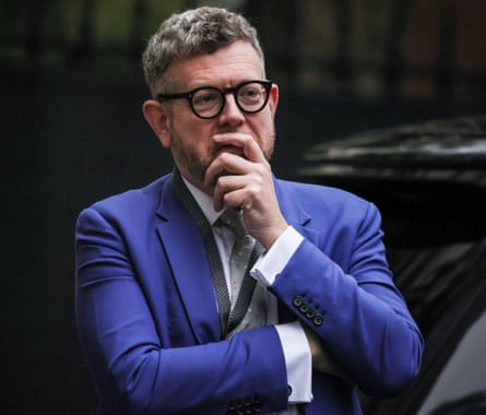 Man in suit and glasses.